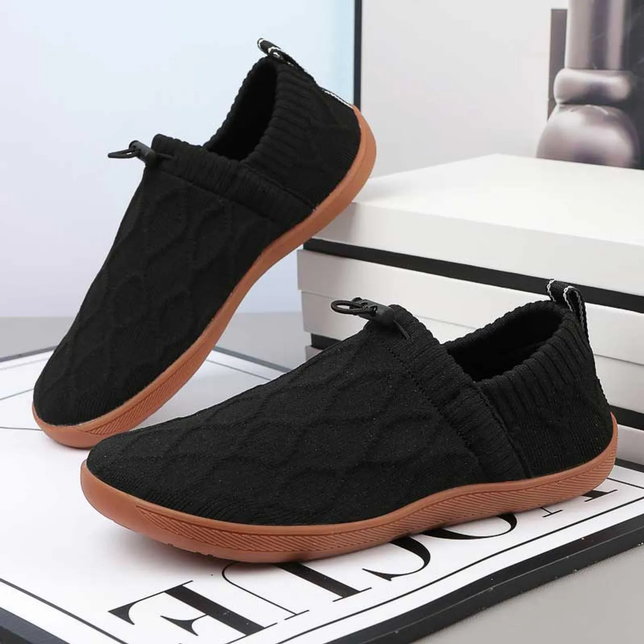 Black flyknit pattern shape slip on shoe sneaker